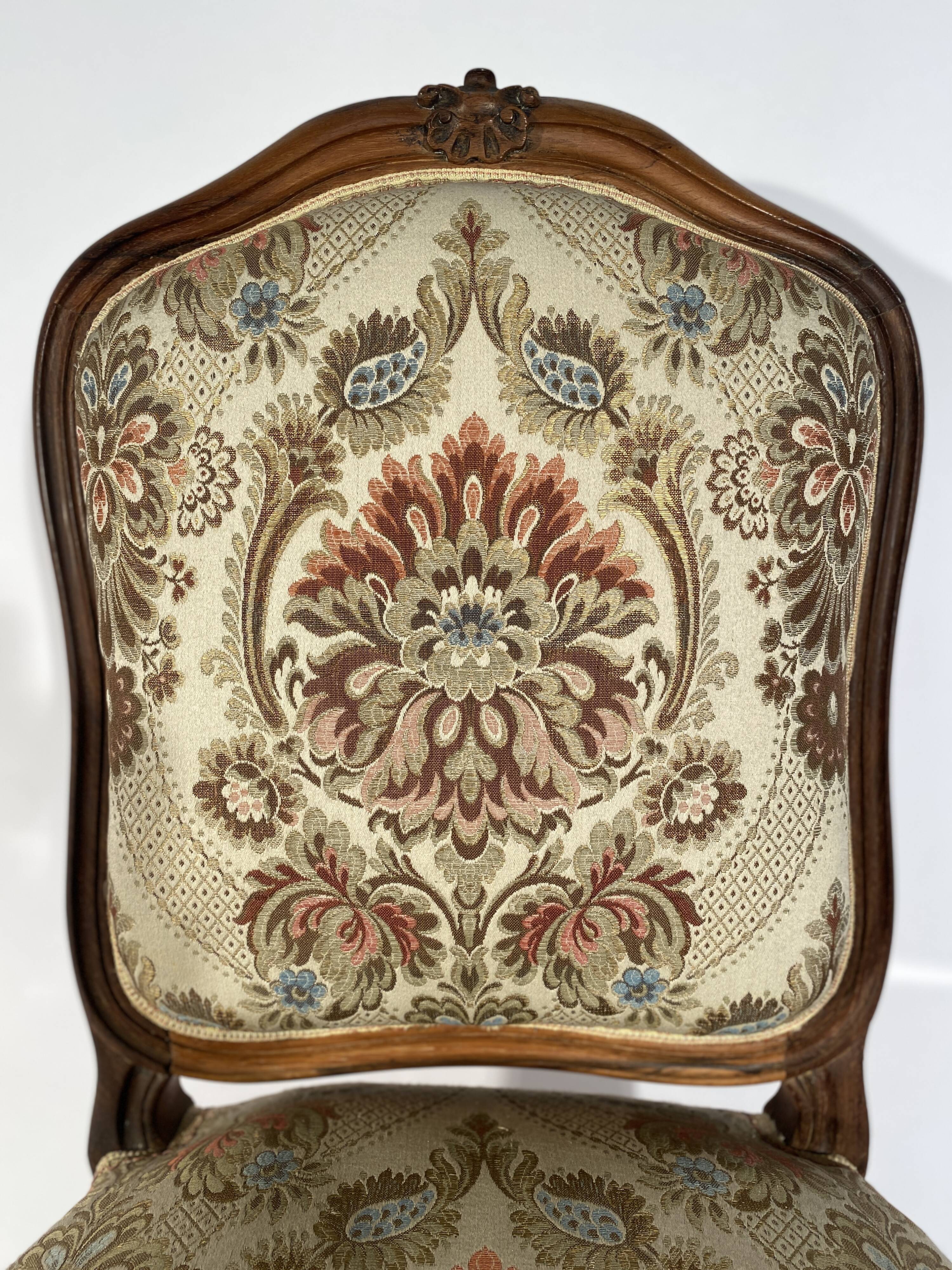 Louis XV style living room including a pair of armchairs and three chairs