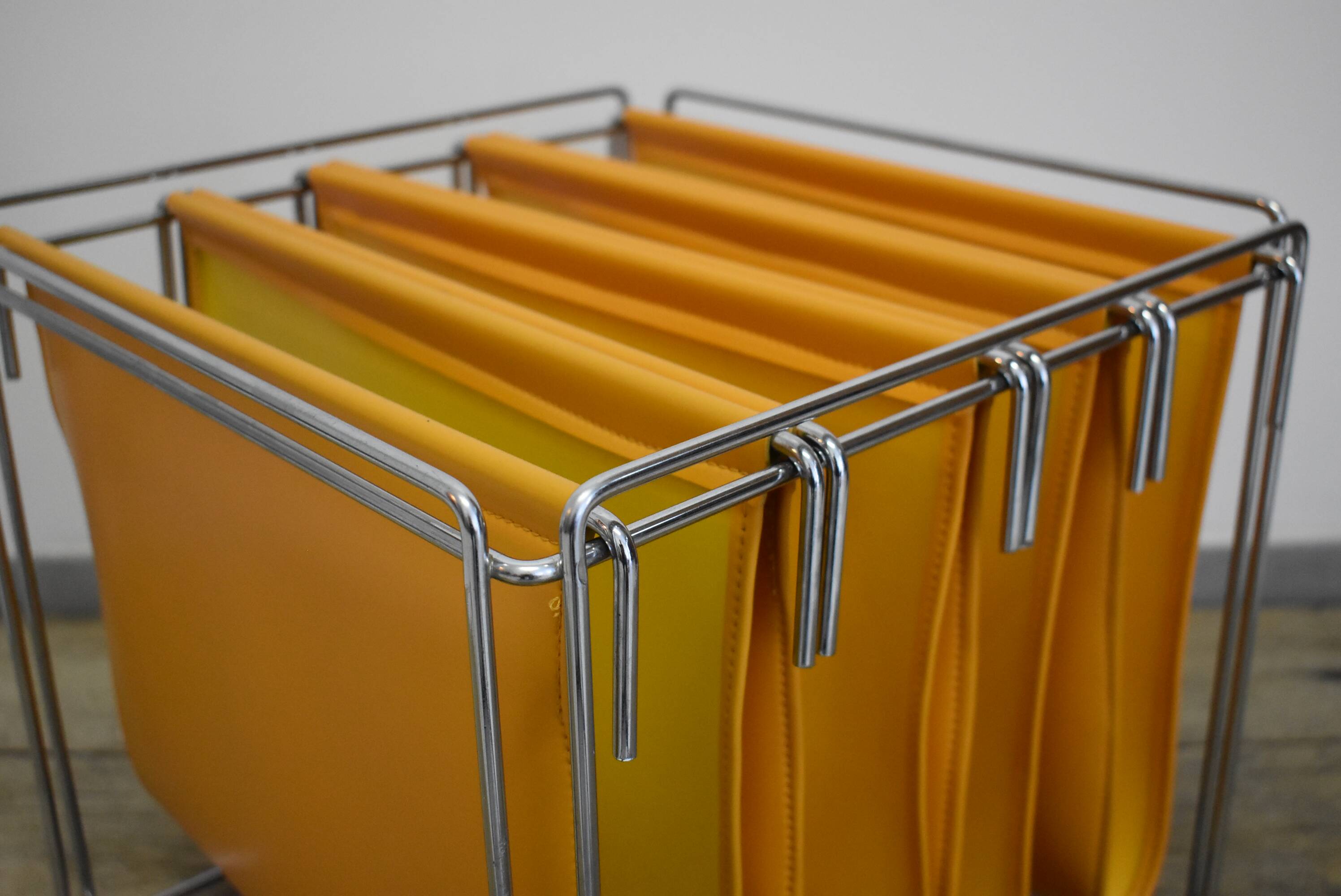 70s Orange magazine holder by Max Sauzé