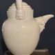 Large white faience jug with a satyr head spout, 19th century.