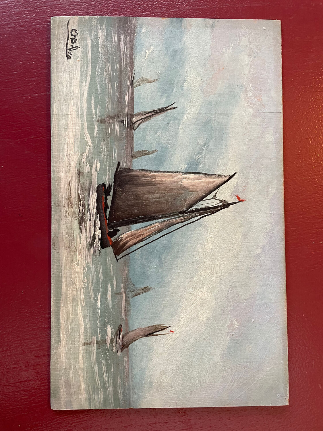 A pair of old paintings on wood.