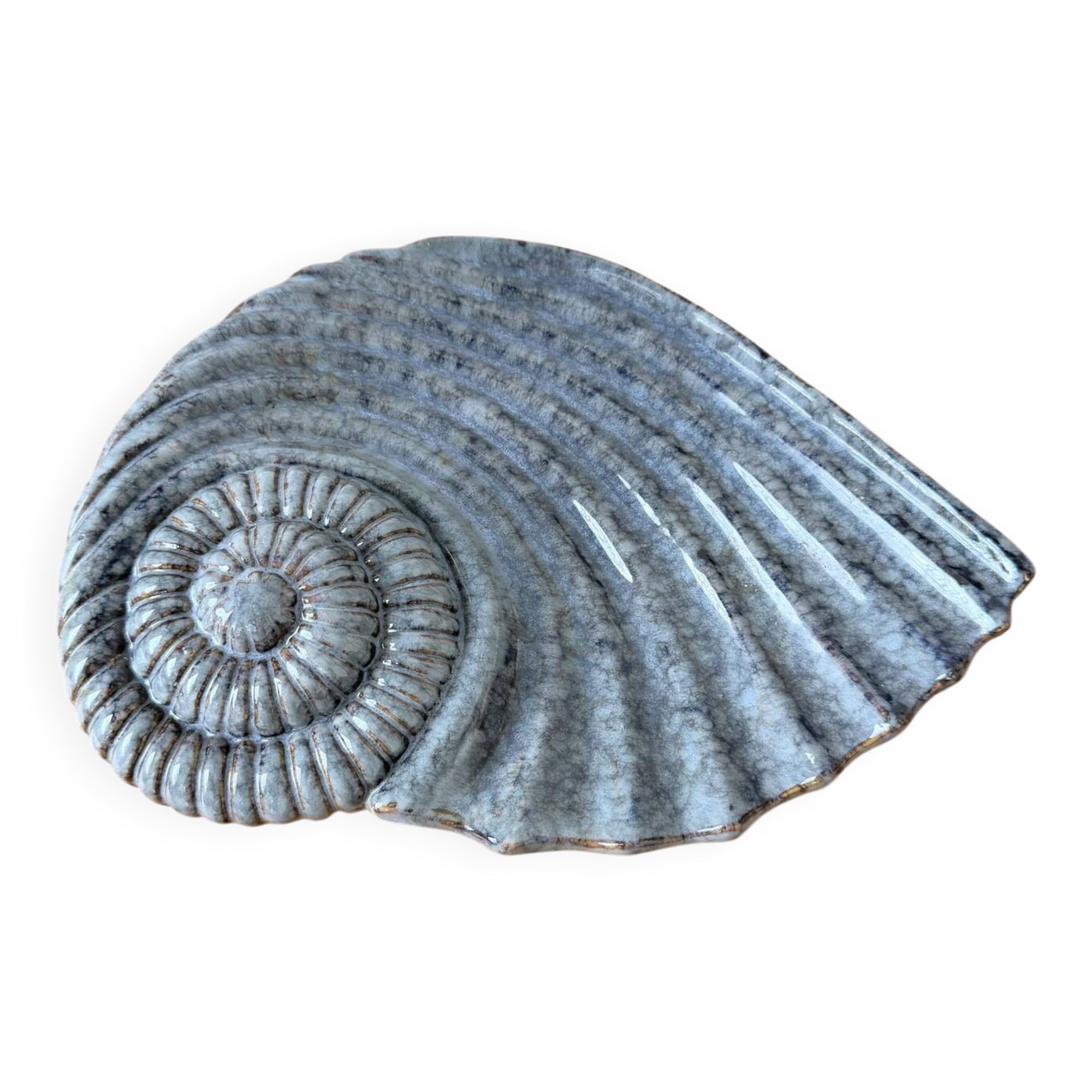 Shell-shaped ceramic catchall.