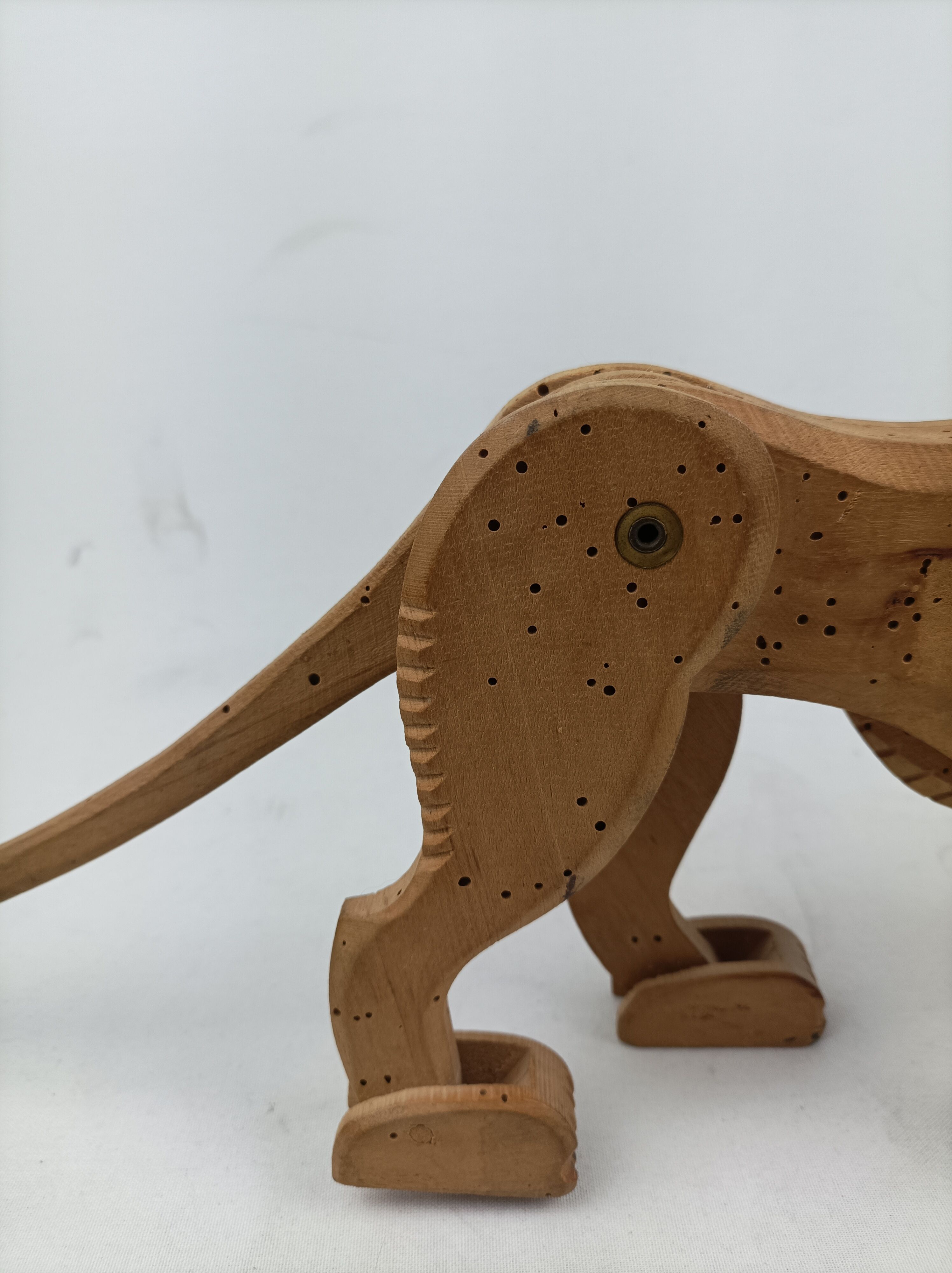 Articulated wooden lion