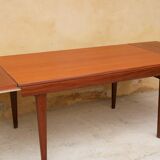 Expandable teak dining table