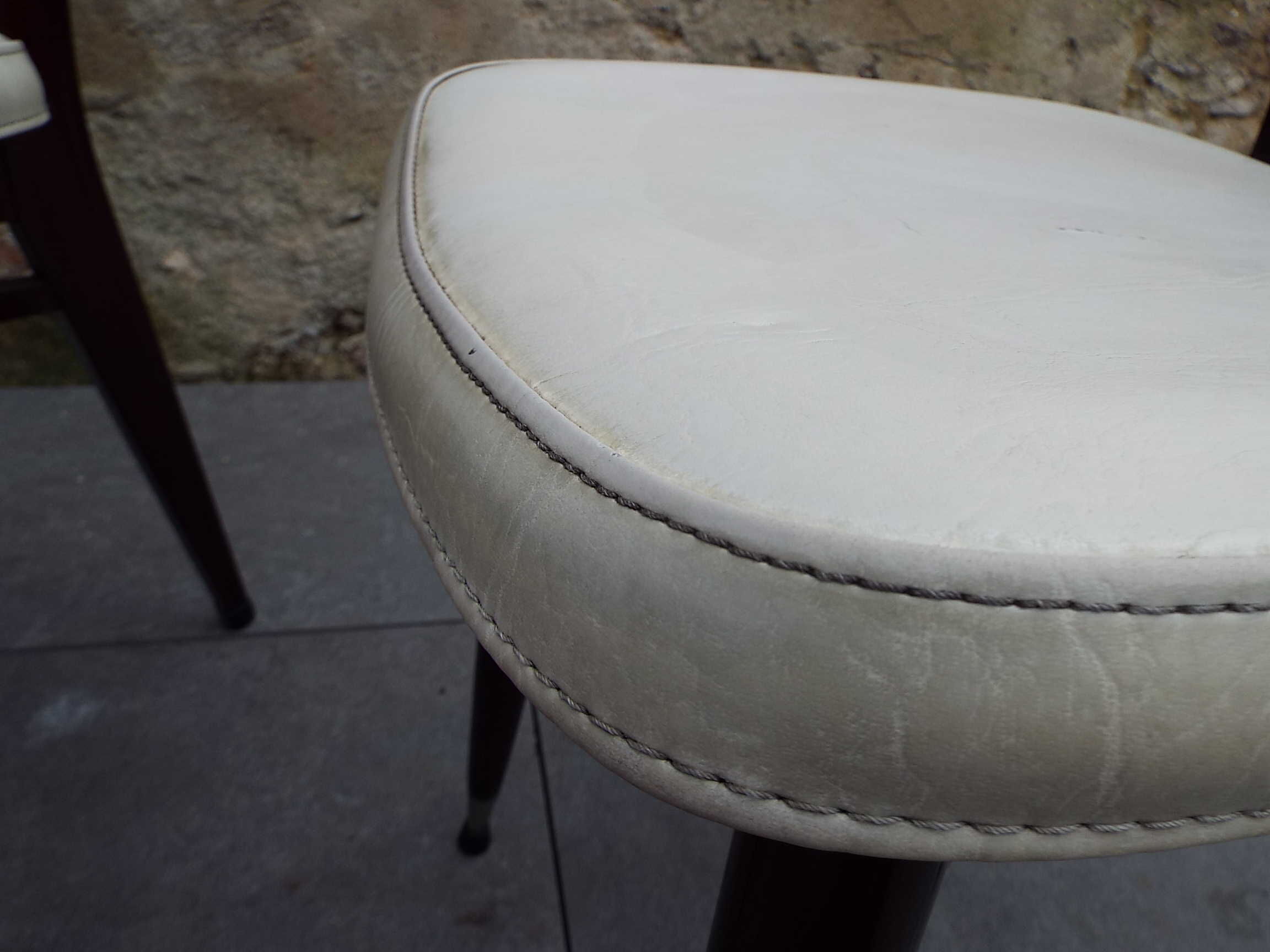 2 skai and wooden chairs