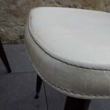 2 skai and wooden chairs