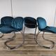 Four 1970s tubular chairs upholstered in blue velvet
