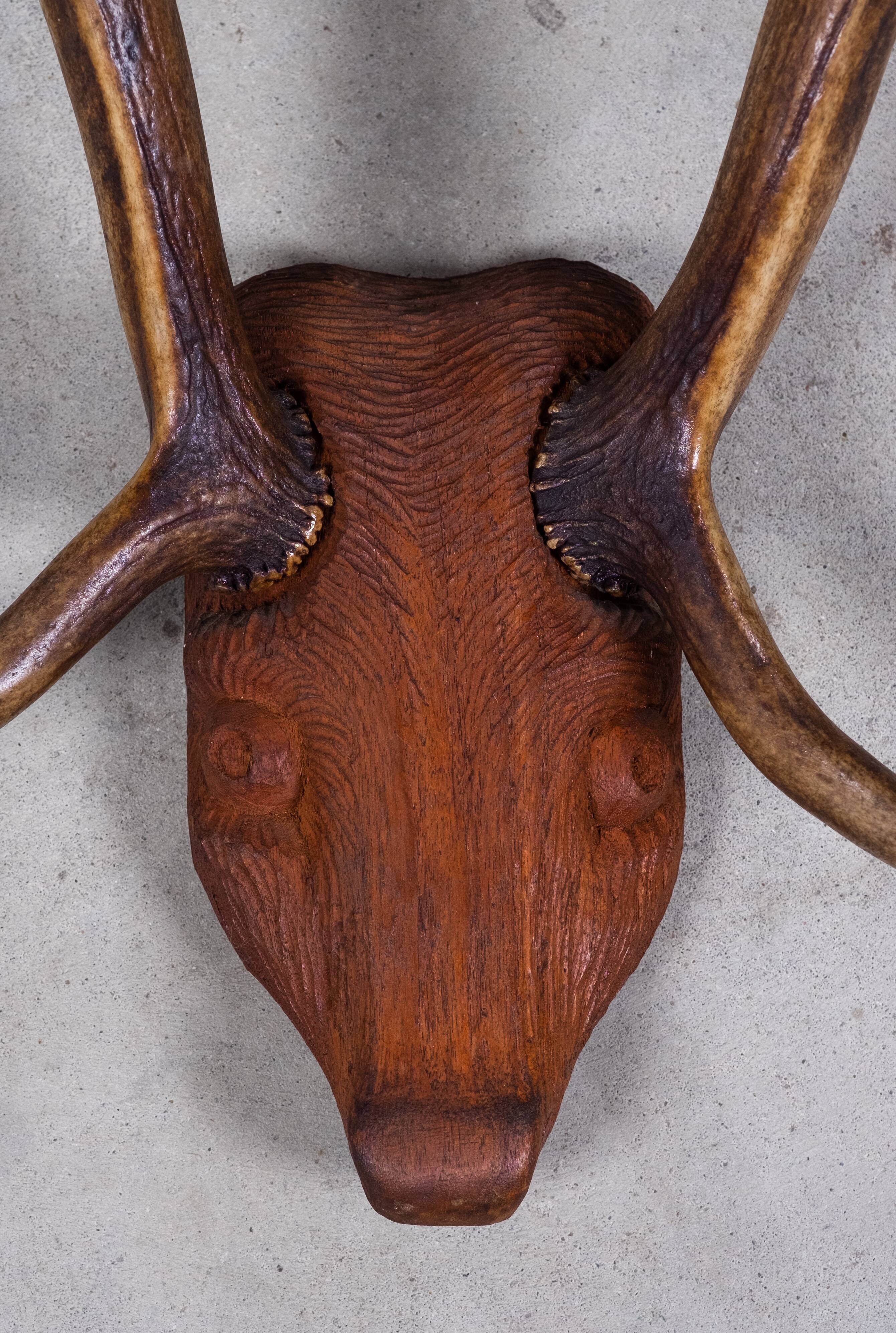 Antlers on carved wooden head, Danish design, 1960s