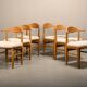 Henning Kjærnulf dining chairs set in Oak and Sheepskin, Denmark, 1960s