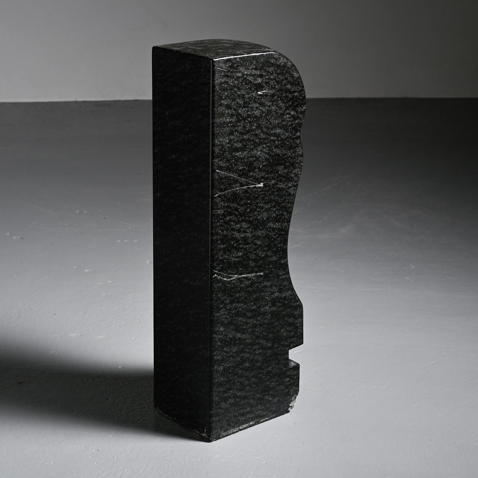 Abstract sculpture in diabase by Robert Neuhauser, Switzerland, circa 1985.