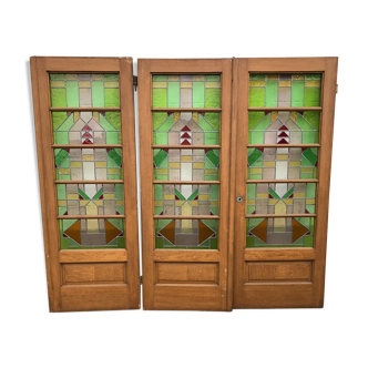 Series of three doors with stained glass windows