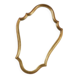 Old wooden mirror gilded with gold leaf