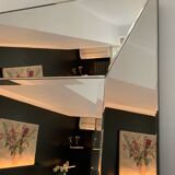 Asymmetrical beveled mirror