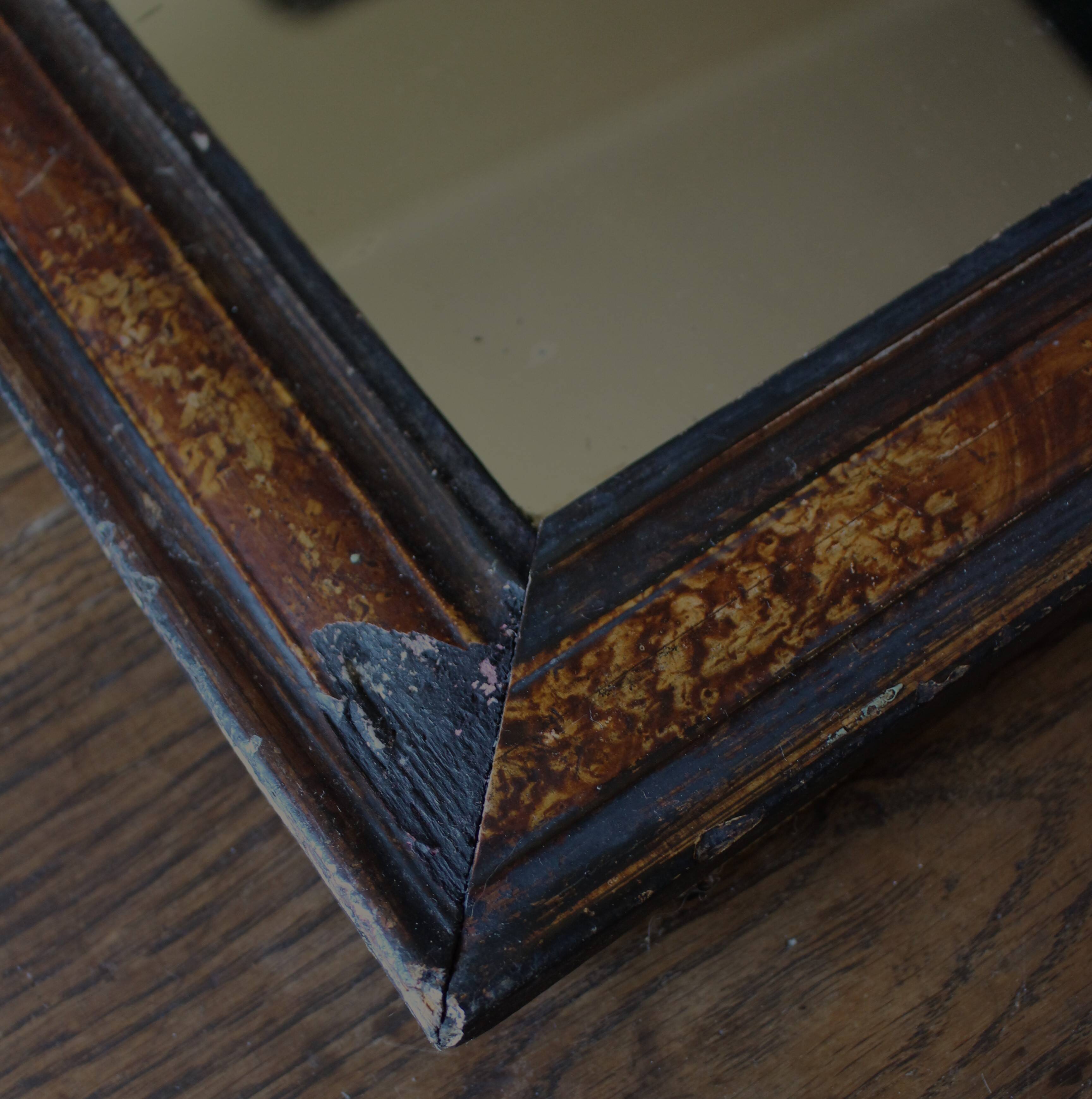 Antique Louis Philippe mirror in black and brown.