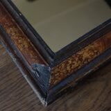 Antique Louis Philippe mirror in black and brown.