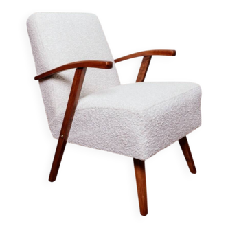 Vintage armchair in pearl white bouclé with walnut wood, 1960.