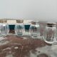 Set of 4 salerons, Christofle goldsmithery, solid silver, pressed molded glass