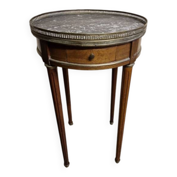 Louis XVI style bouillotte table in mahogany with a grey marble top.