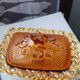 amber-colored pressed glass butter dish