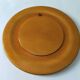 Round top in carved wood and vintage varnish