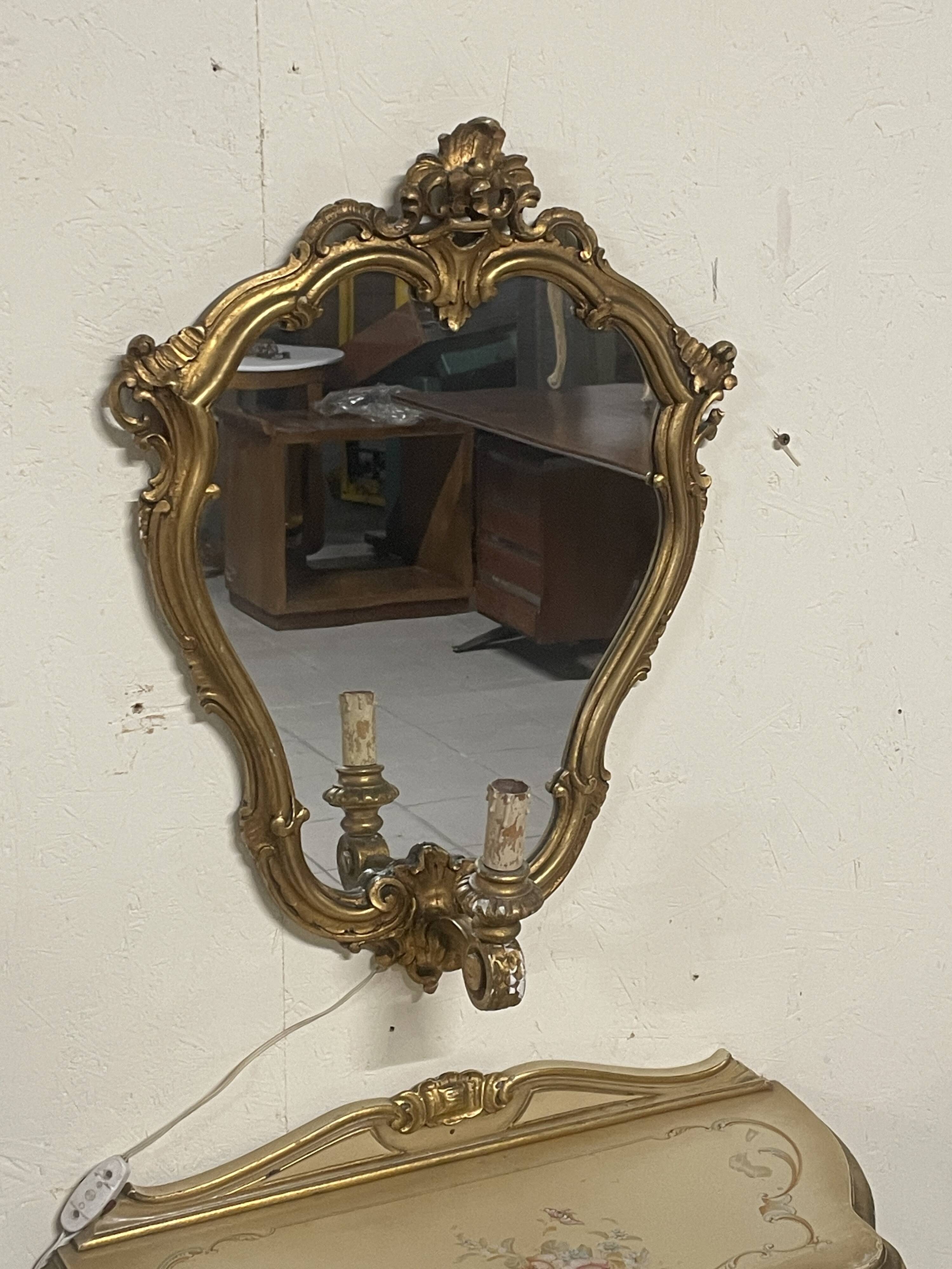Pair of wall-mounted consoles with a mirror in Louis XV style.
