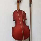 violin and decorative archer in antique varnished wood