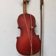 violin and decorative archer in antique varnished wood