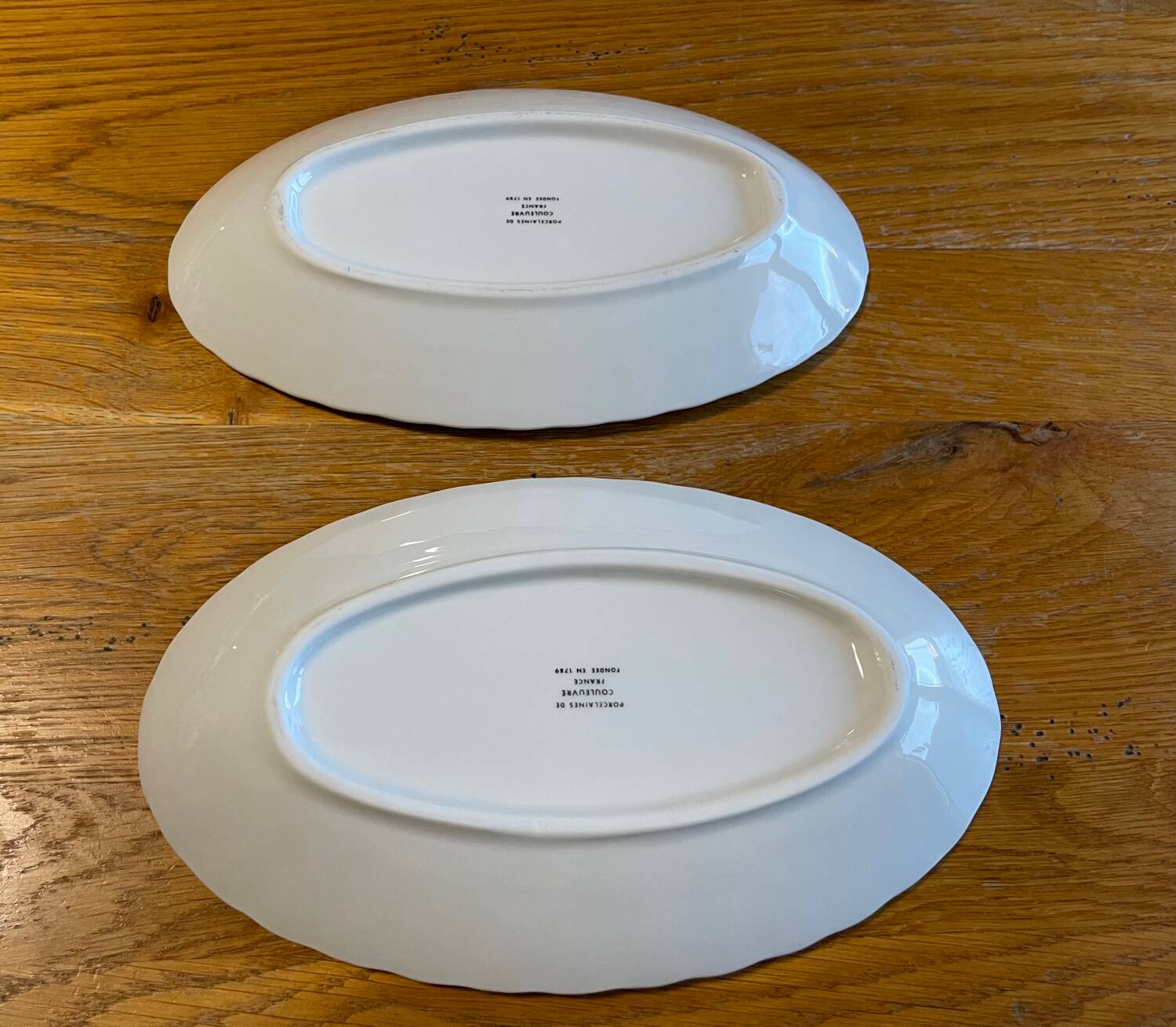 Set of two snake-patterned porcelain dishes.