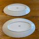 Set of two snake-patterned porcelain dishes.