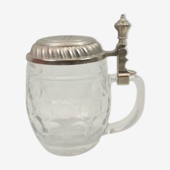 Glass beer chop and 13 cm tin lid