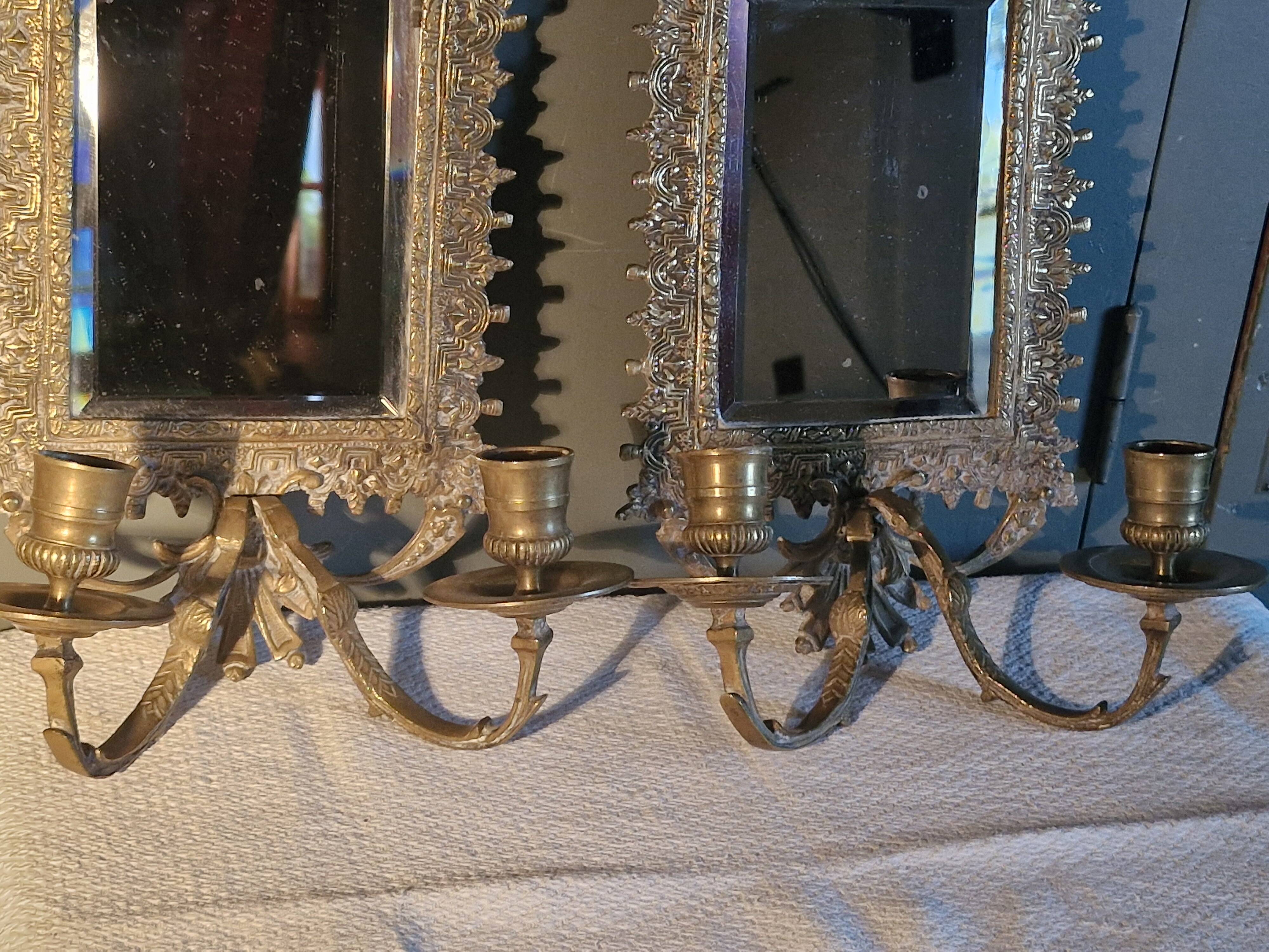 Pair of mirror sconces/candle holders in 19th-century bronze.