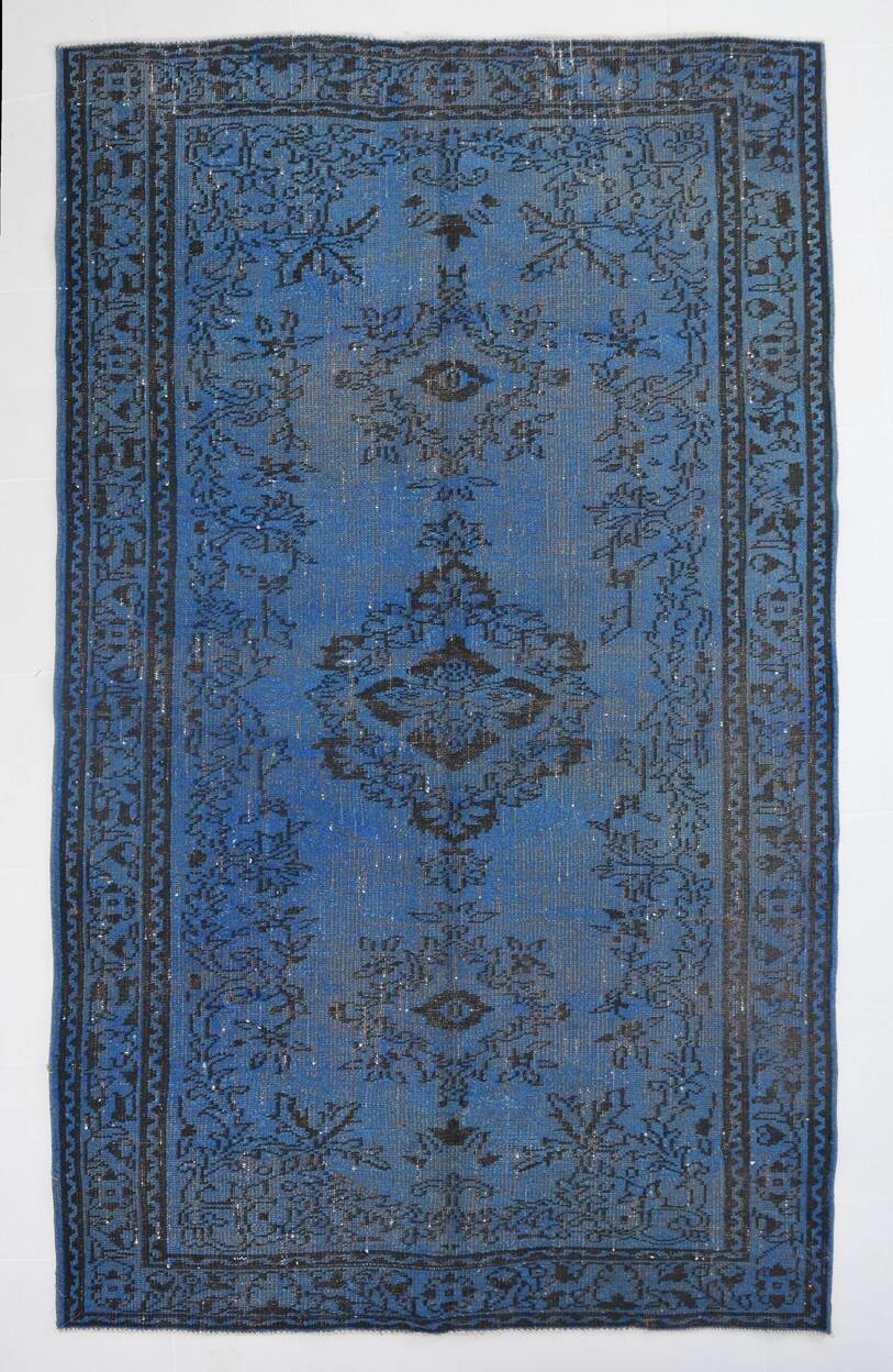 Vintage blue and black Turkish rug with traditional design, 163 × 268 cm