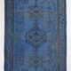 Vintage blue and black Turkish rug with traditional design, 163 × 268 cm