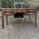 Art Deco desk in varnished mahogany.
