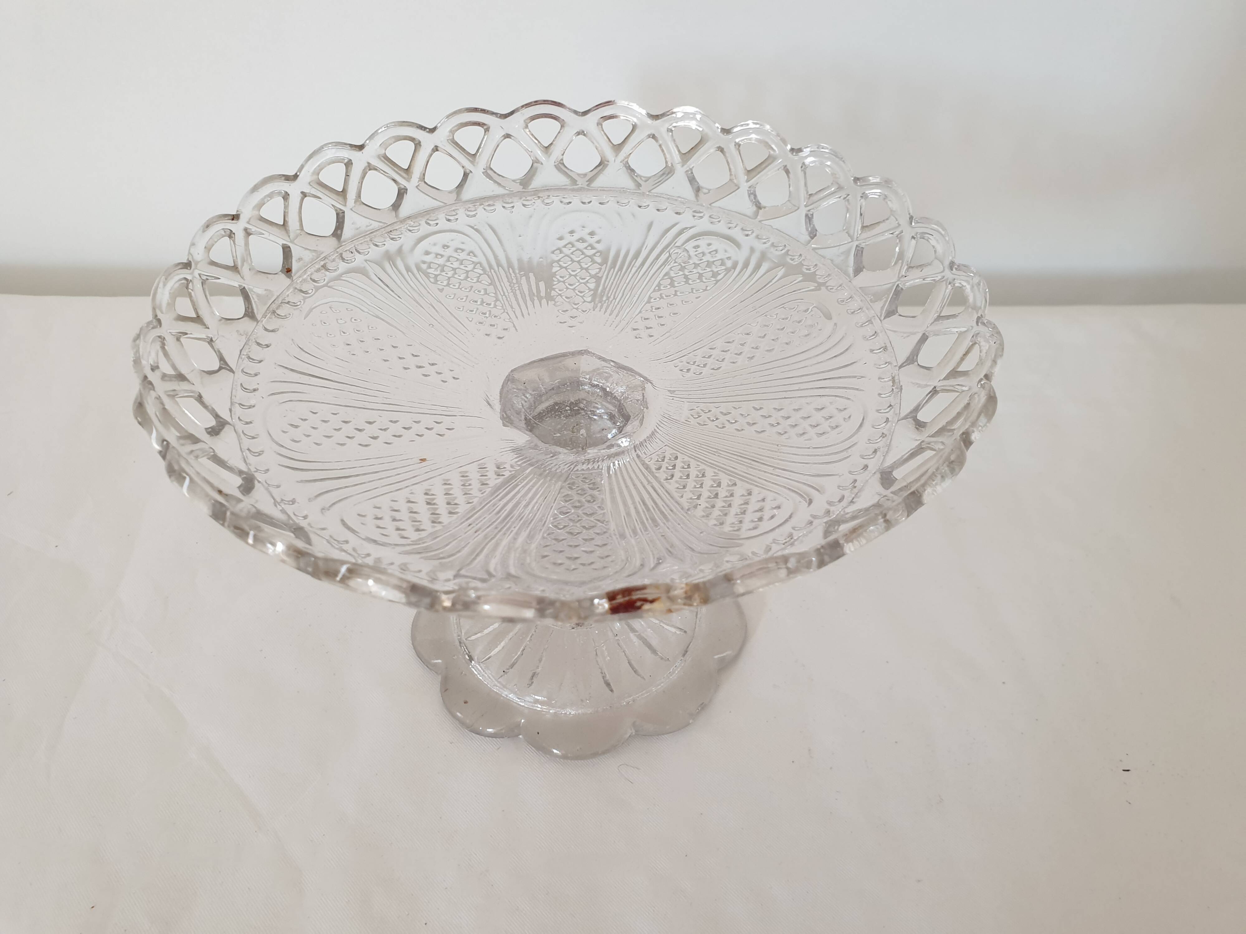 Old cup in molded glass colorless decorative table mignardises