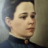 Oil on canvas portrait in an antique gilded wooden frame.
