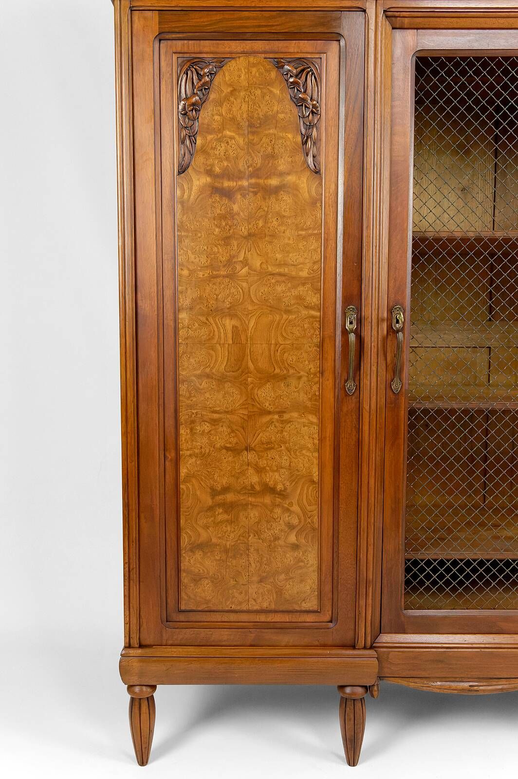 Art Deco showcase bookcase in carved walnut, France, circa 1925