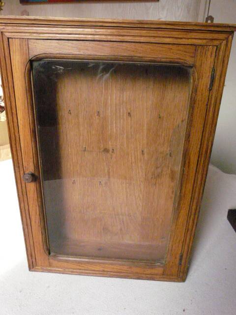 Old watchmaker's furniture wall display case
