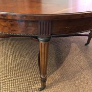 Important central pedestal table in mahogany, brass and bronze that can form a large dining table.