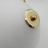 Pair of articulated arm wall lights in brass with opaline globe