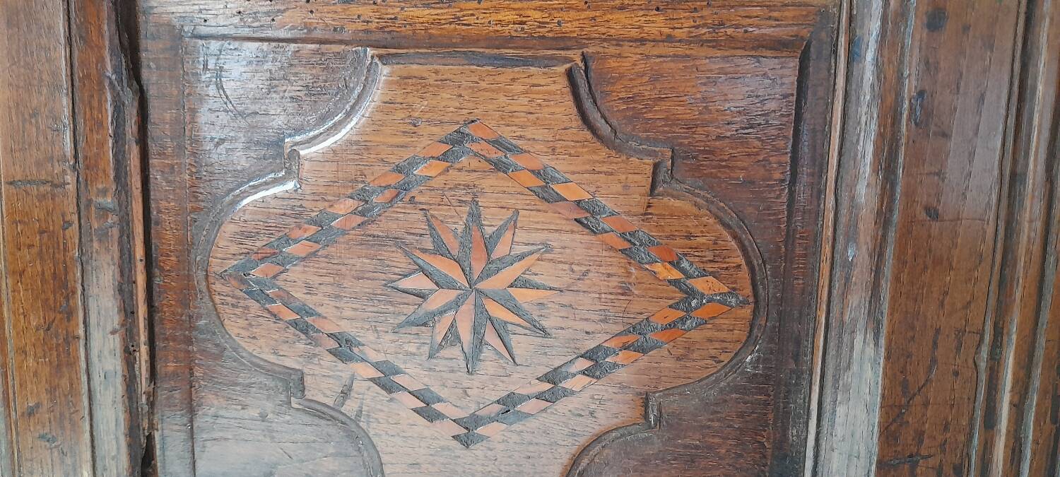 Old marquetry and solid wood chest