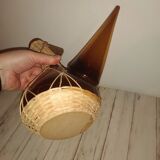 glass and wicker beak bottle