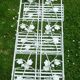 Folding white wrought iron shelf