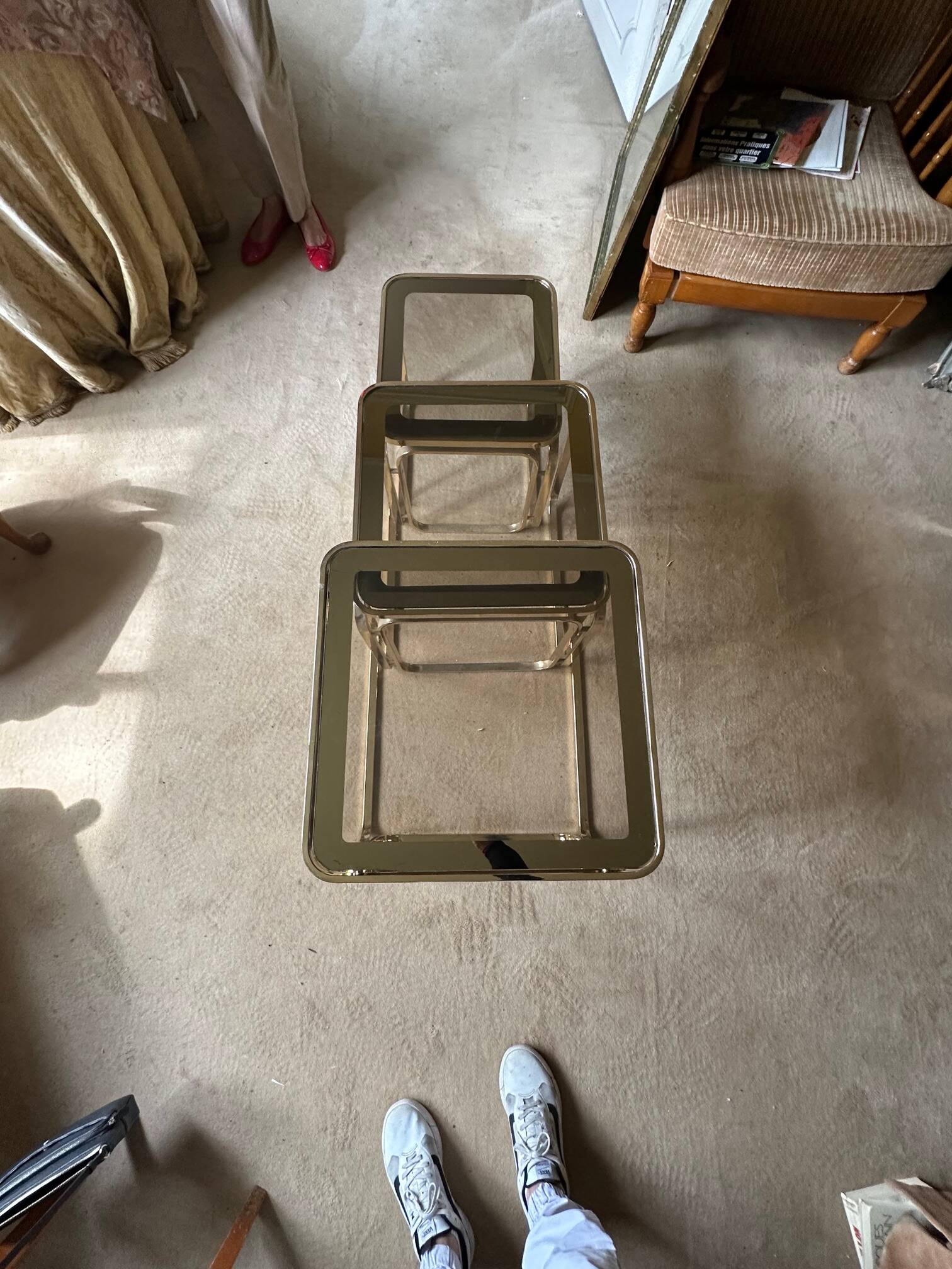 Brass nesting tables with smoked glass tops
