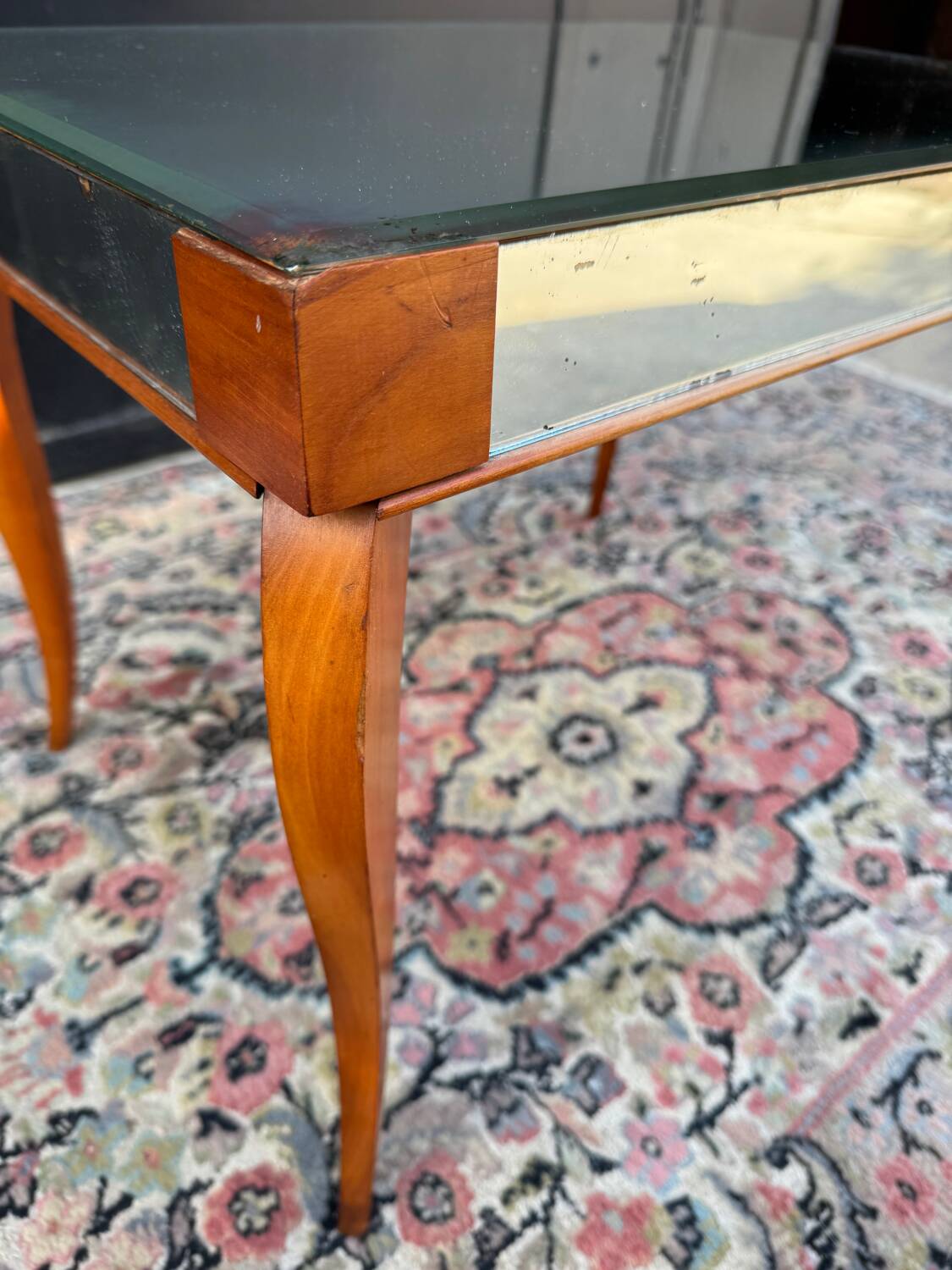 Small wooden coffee table with a mirror from the 1950s.