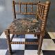 Old pair of corner chairs known as 'fireplace corner' armchairs.