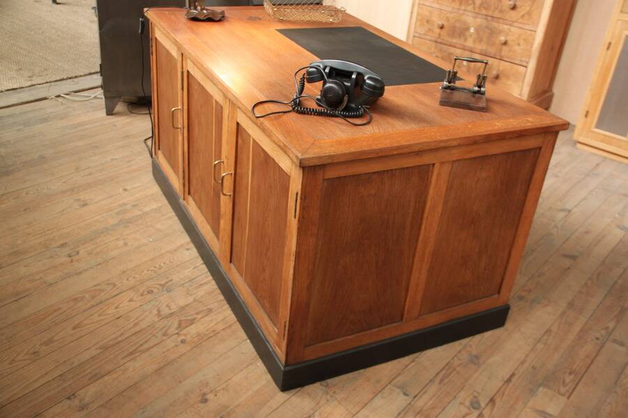 Double administrative desk with cupboard and drawer.