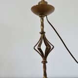 Large "Arts & Crafts" style lamp in beaten iron with a golden patina.