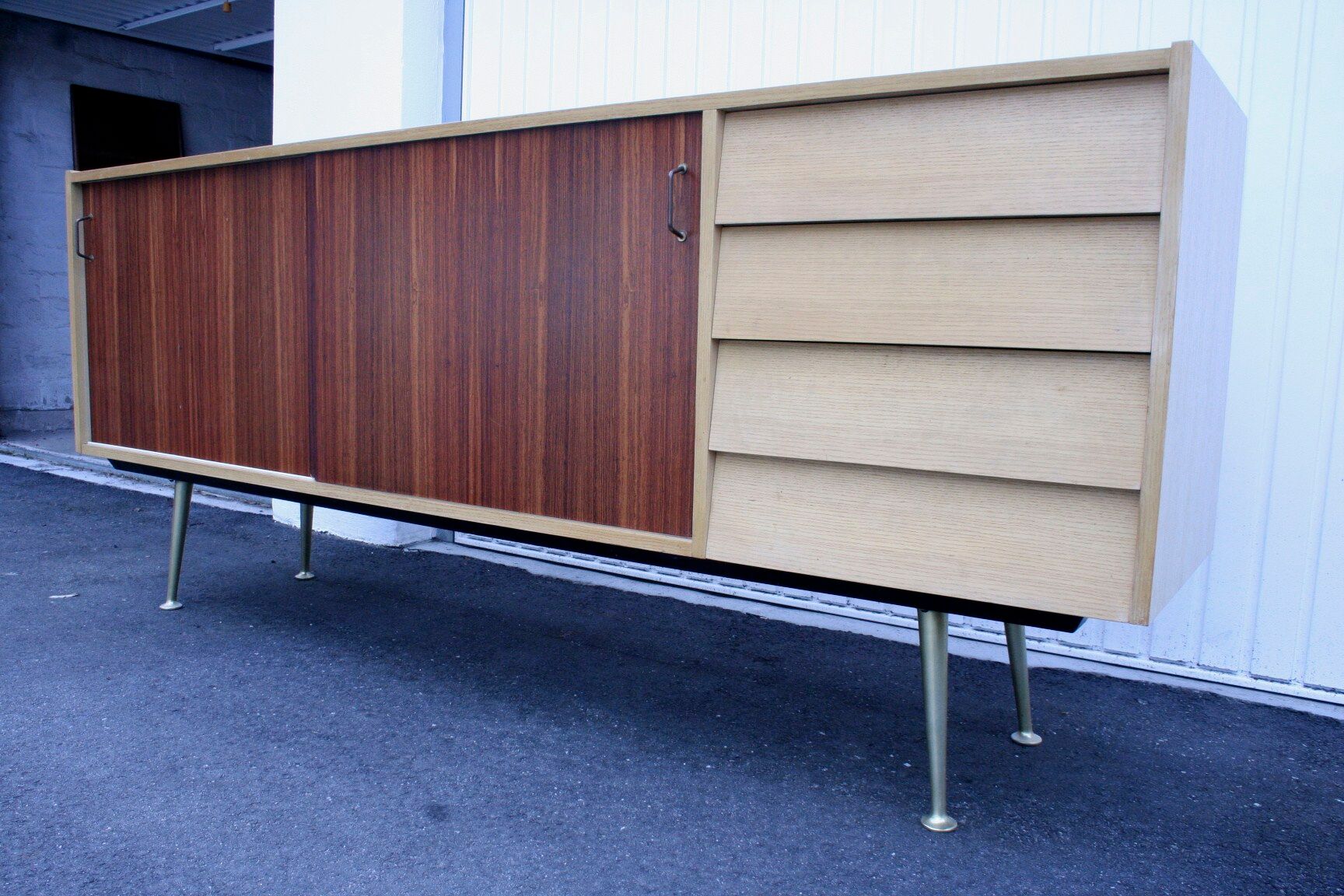 Midcentury sideboard with brass legs
