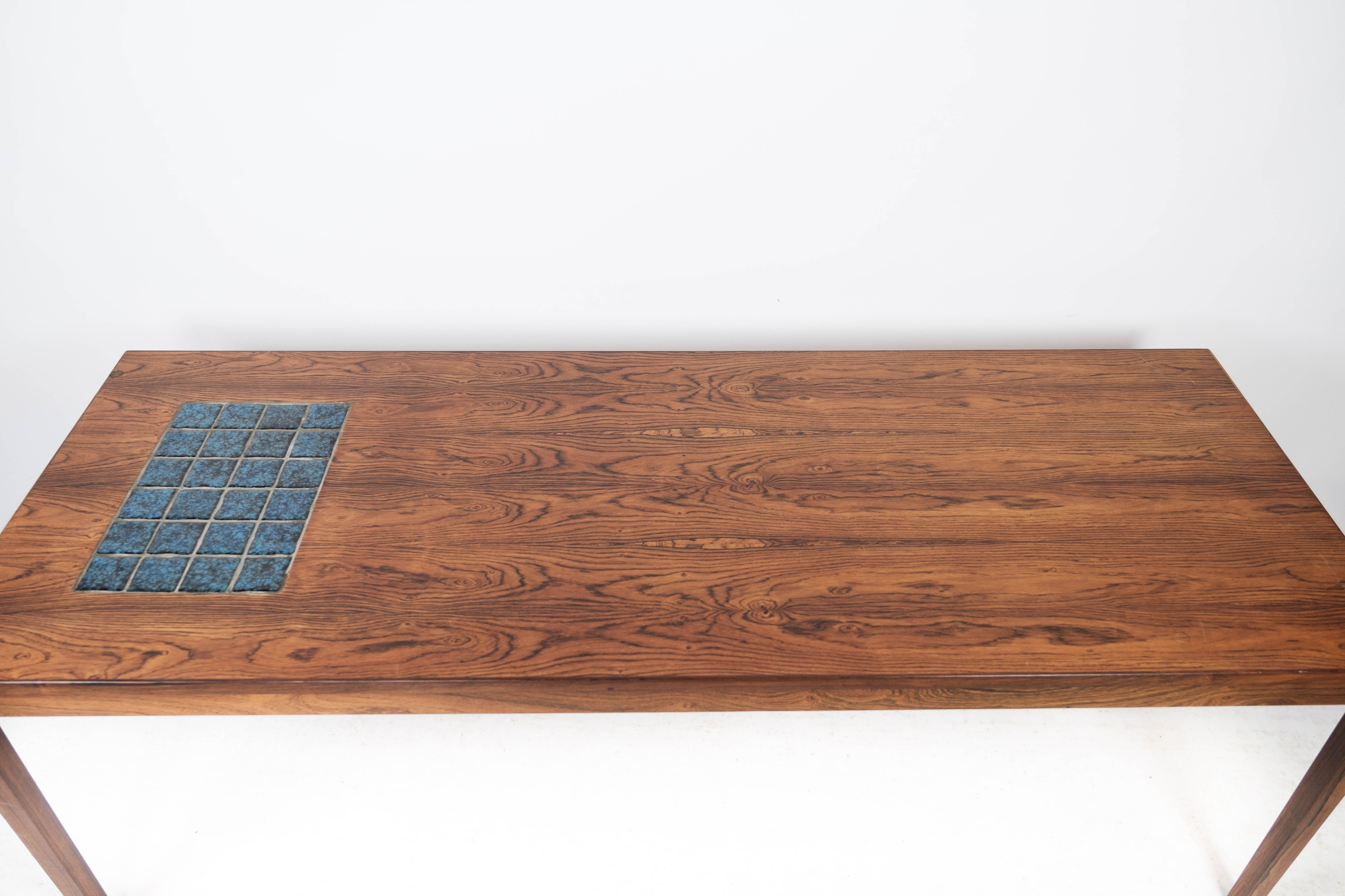 Coffee table in rosewood with blue tiles of Danish design from the 1960s