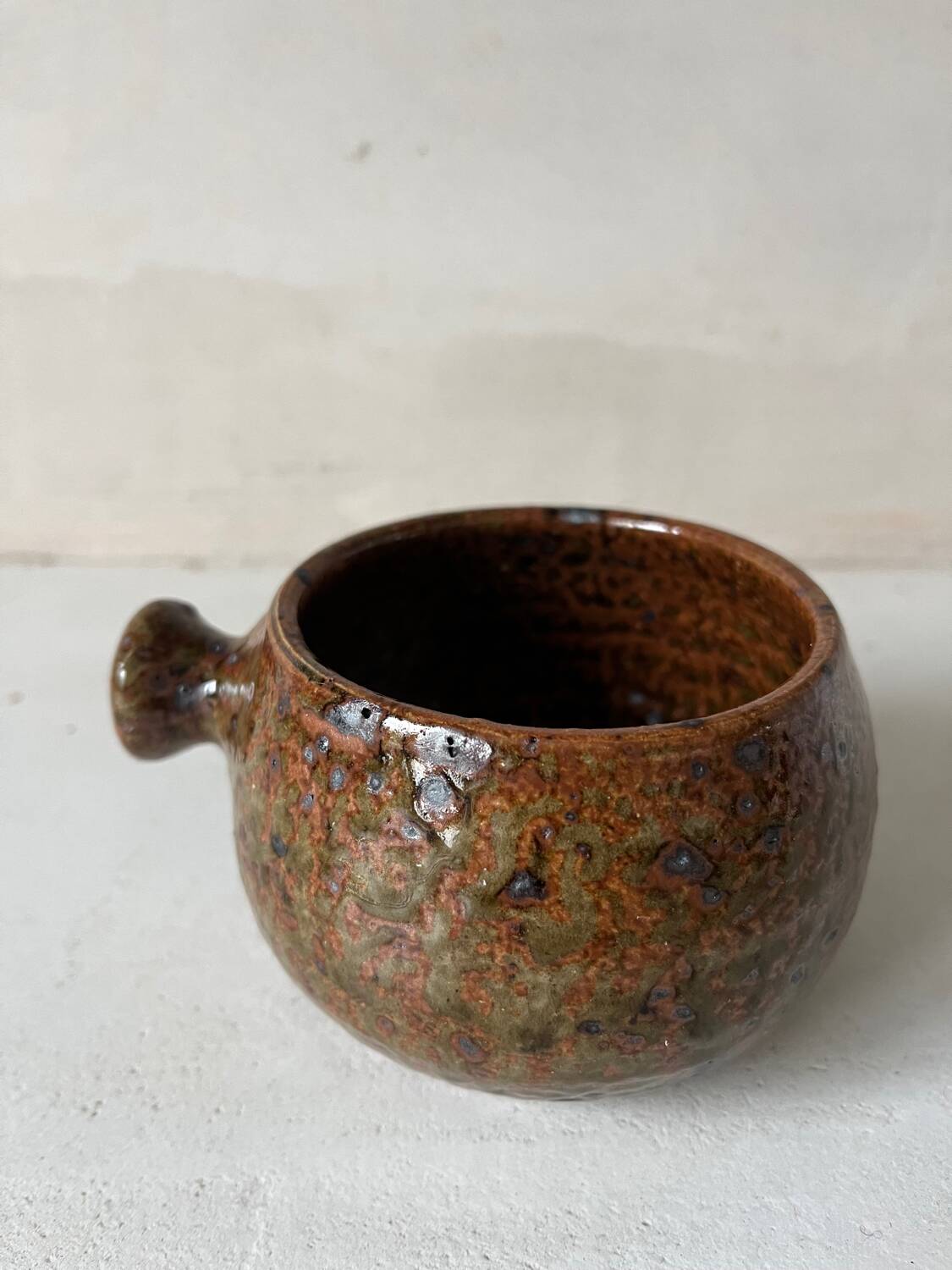 Old pyrite stoneware fondue pot